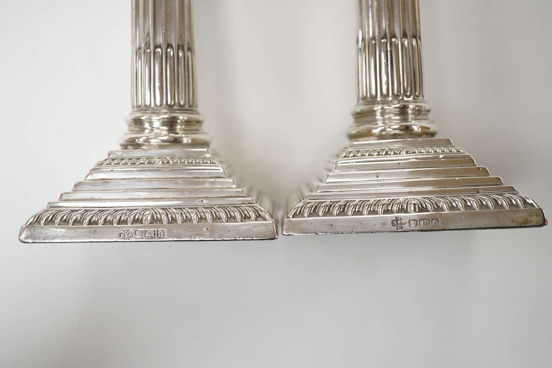 A pair of Edwardian silver mounted Corinthian column dwarf candlesticks, by Jay, Richard Attenborough Co Ltd, Sheffield, 1905, height 16.3cm, weighted.